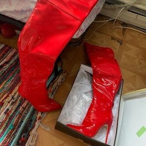 Red stiletto knee-high heels